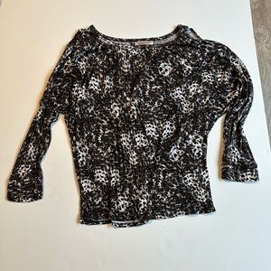 Jennifer Lopez shirt. White and gray design.